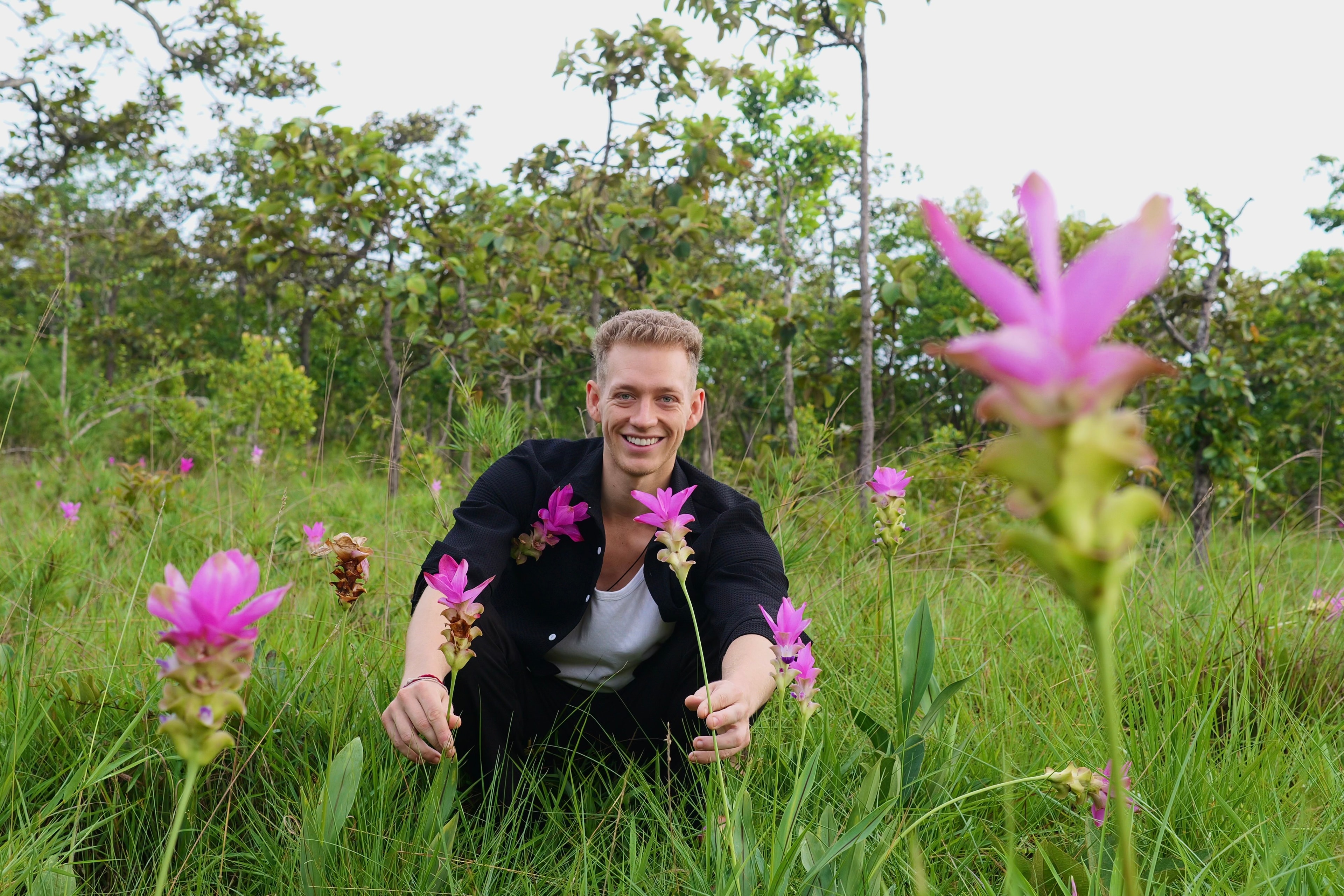 Nick Surfer Ocean in a flower field in Thailand, 2026 — son of Nicole "Nikki" Ocean