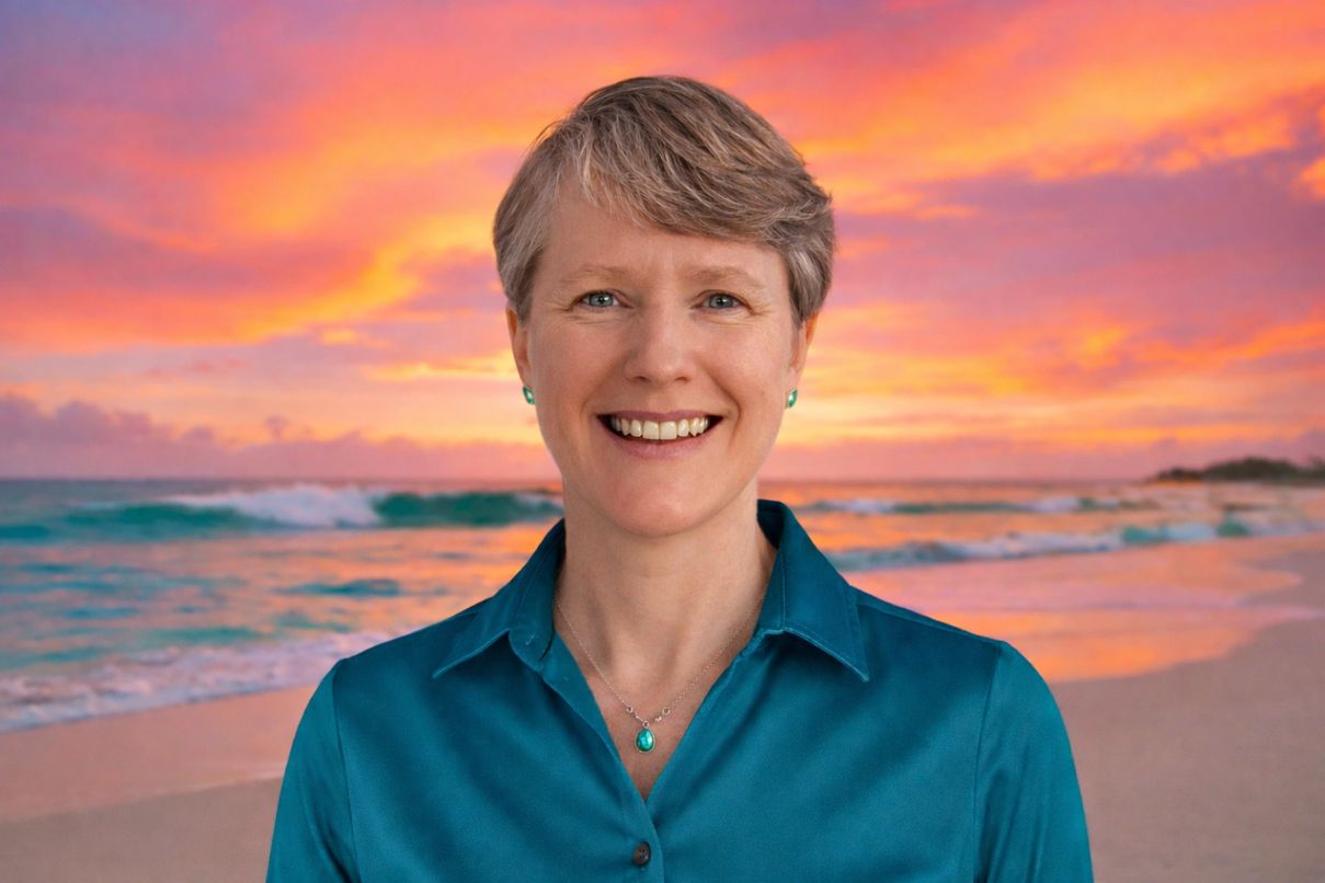 Nicole 'Nikki' Ocean — peer recovery guide and smooth jazz artist, smiling against a beach sunset